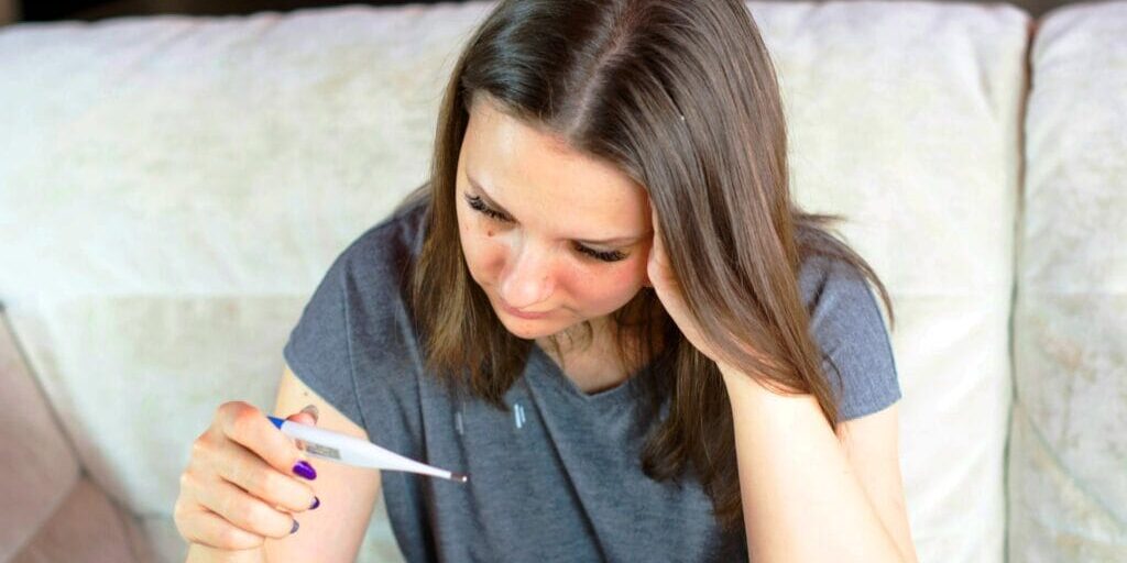 bridge-centre-derby-fertility-issues-2 Woman holding a thermometer
